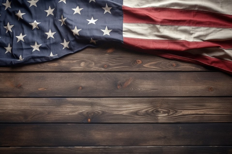 National flag draped across dark wooden boards