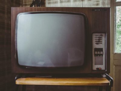 Old wooden television set in a living room