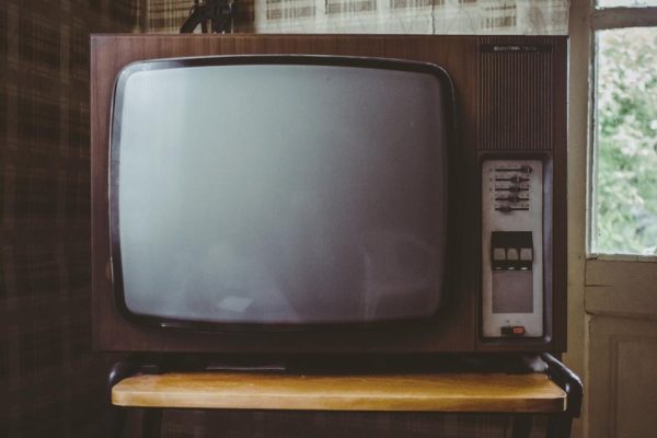 Old wooden television set in a living room